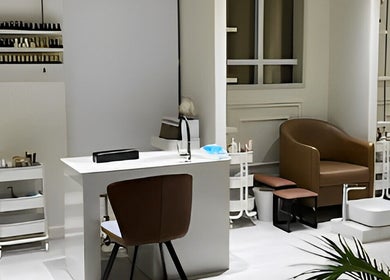 Chic salon setup at Assort Spa & Beauty Salon, Muscat, Muscat Governorate, OM showing seating and nail stations.
