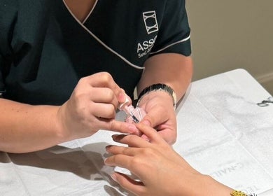 Nail care session at Assort Spa & Beauty Salon, Muscat Governorate, OM, highlighting professional service.