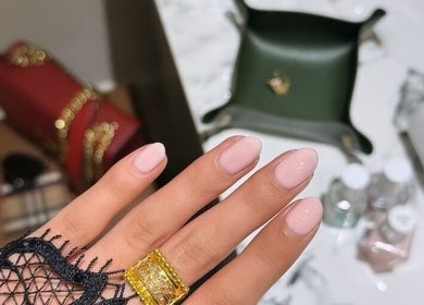 Elegant gel manicure at Assort Spa & Beauty Salon, Muscat, Muscat Governorate, OM with stylish accessories.
