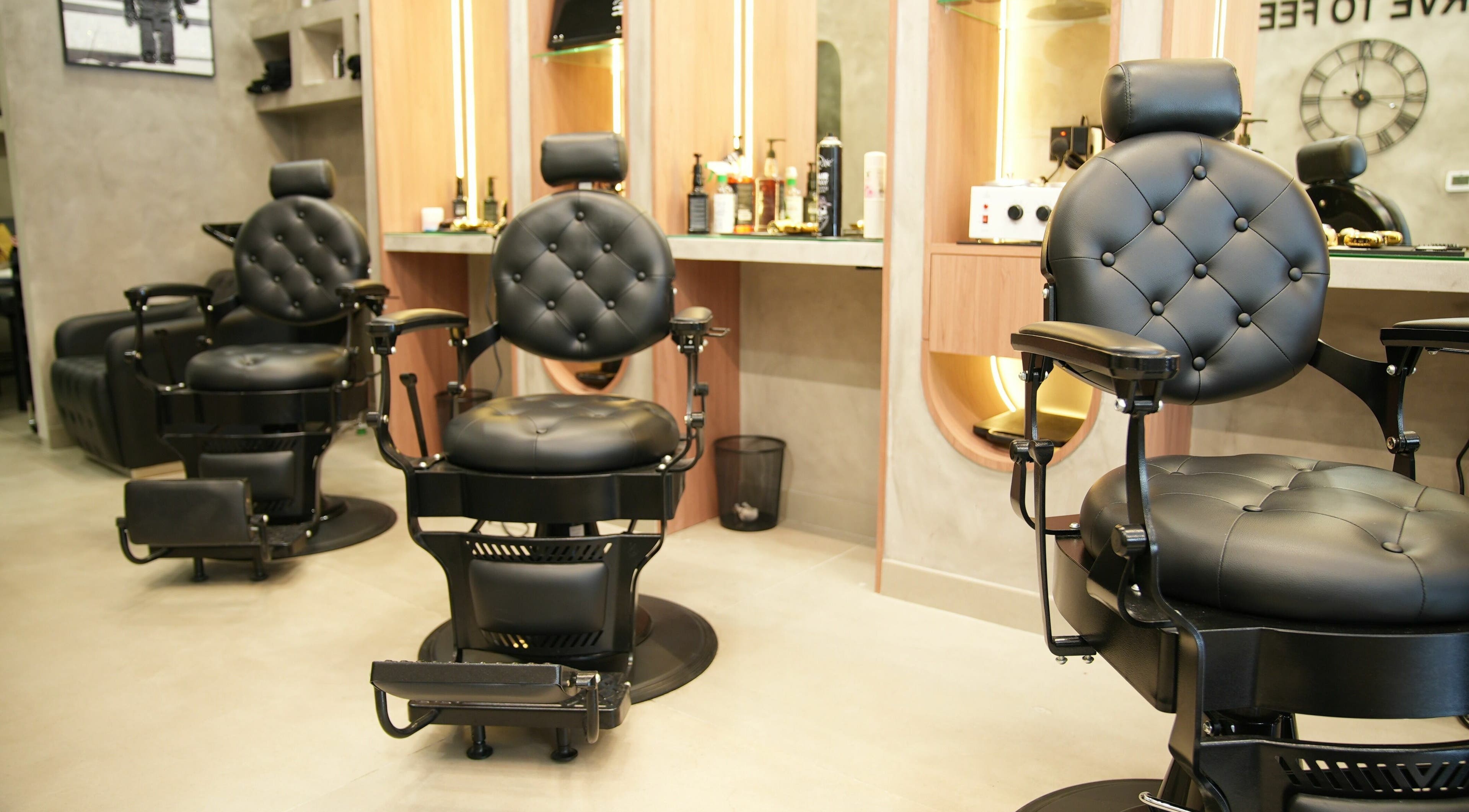 Elegant barber chairs at Soledair Gents Salon - Azizi Riviera in Dubai, AE offering premium grooming experiences.