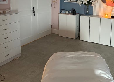 Serene Aesthetic Clinic's relaxing treatment room showcasing elegant decor in Poole, England, GB.