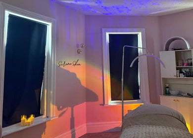 A cozy treatment room with soft lighting at Serene Aesthetic Clinic, Poole, England, GB.