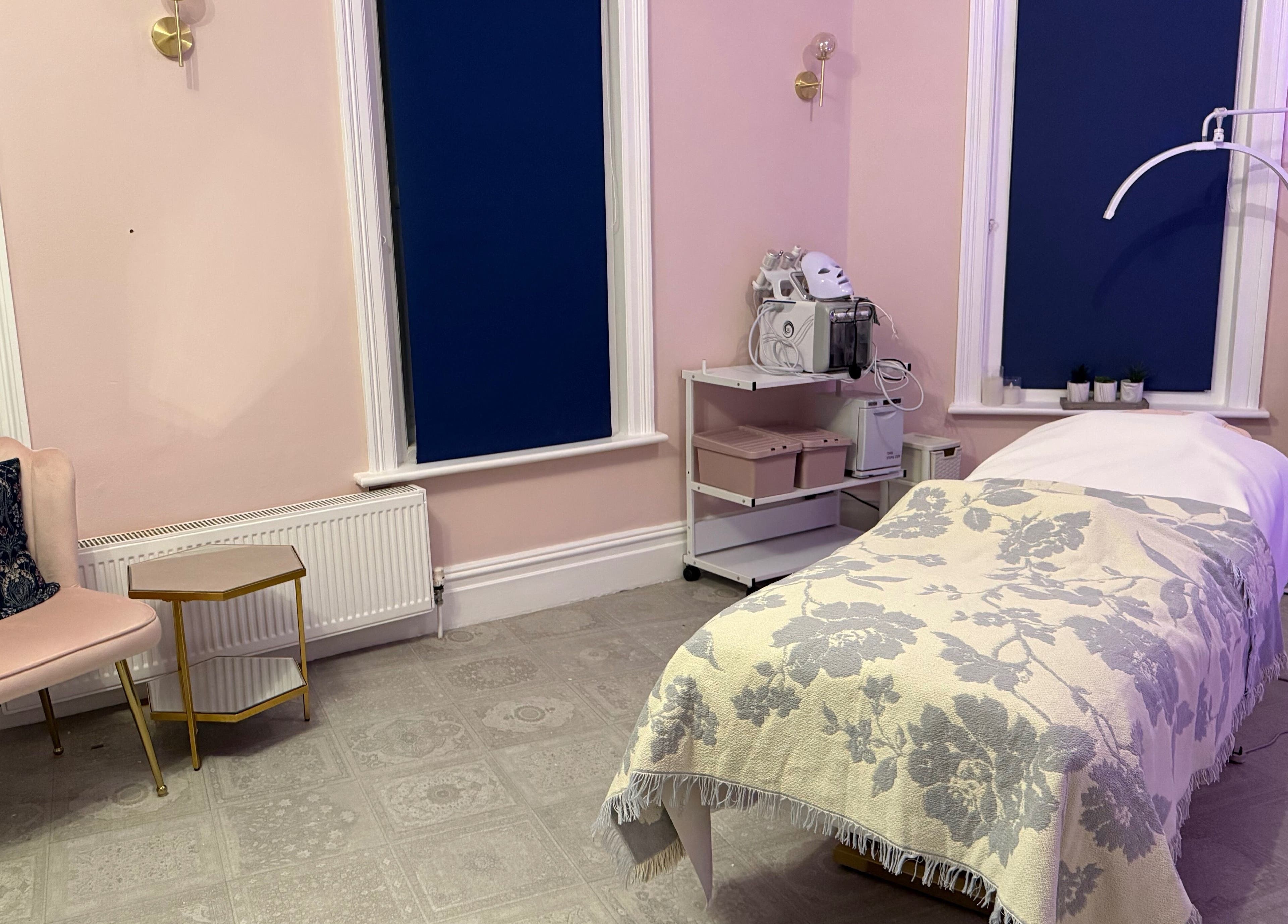 Chic treatment room at Serene Aesthetic Clinic, Poole, England, GB showcasing relaxing decor and equipment.