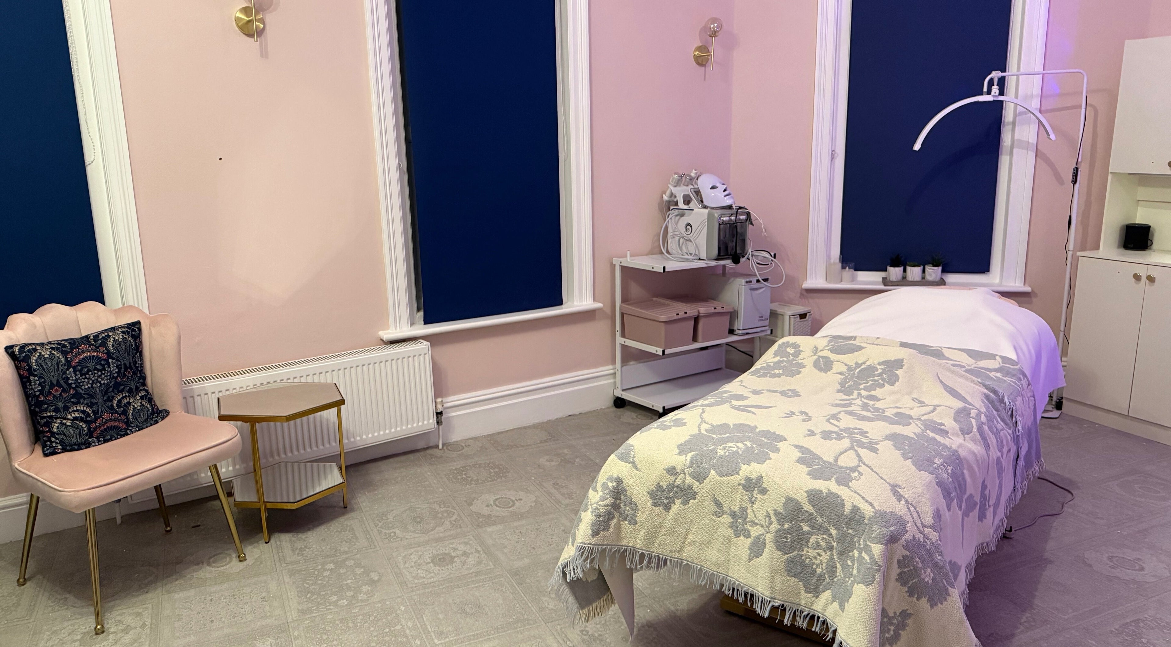 Chic treatment room at Serene Aesthetic Clinic, Poole, England, GB showcasing relaxing decor and equipment.