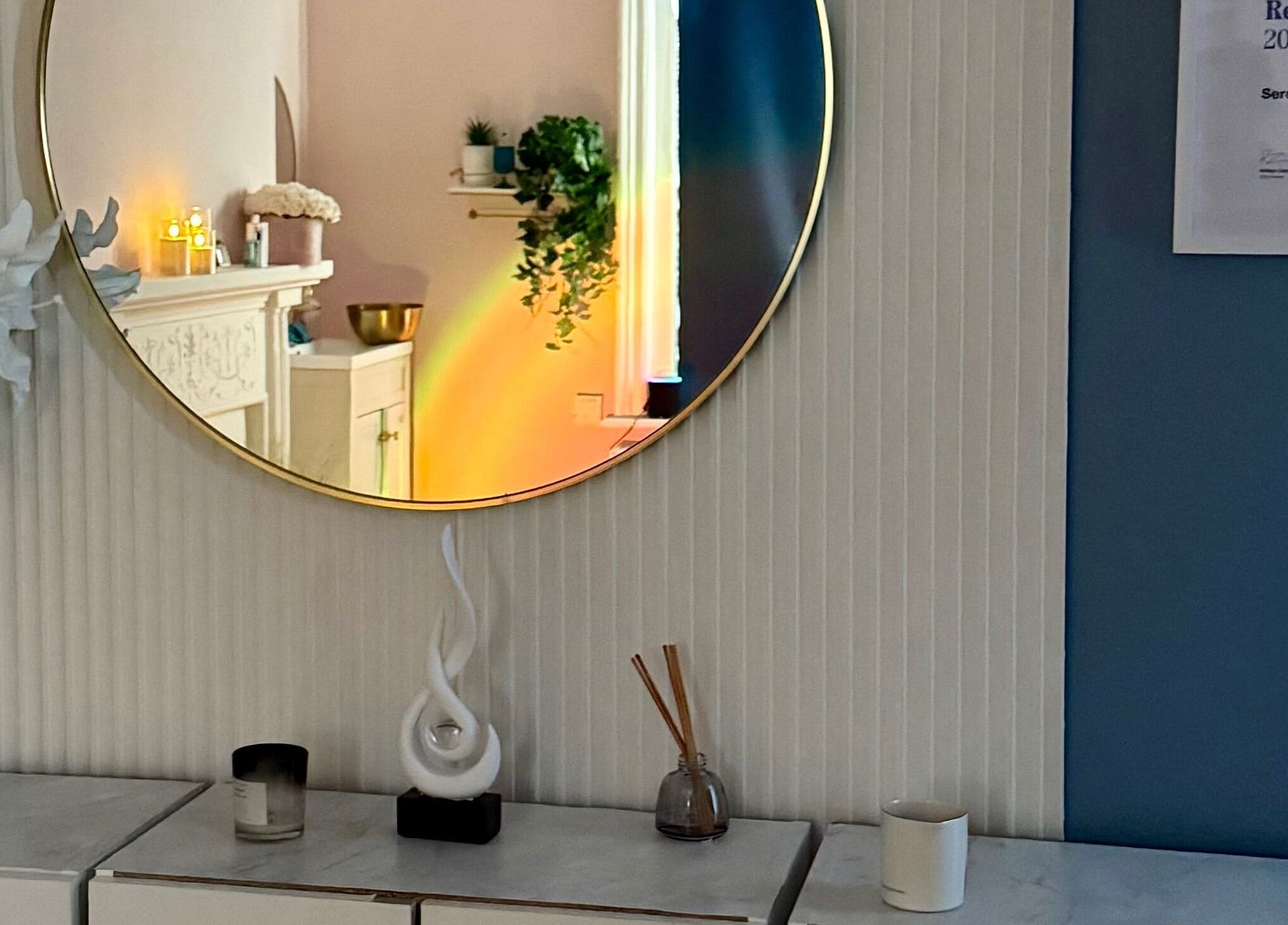 Elegant mirror reflection at Serene Aesthetic Clinic, Poole, England, GB with ambient decor and soothing hues.