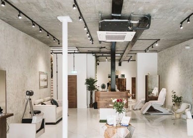 Interior of Saheed Hair Studio@ Hair Bian in London, England, GB, showcasing modern chic decor and styling chairs.