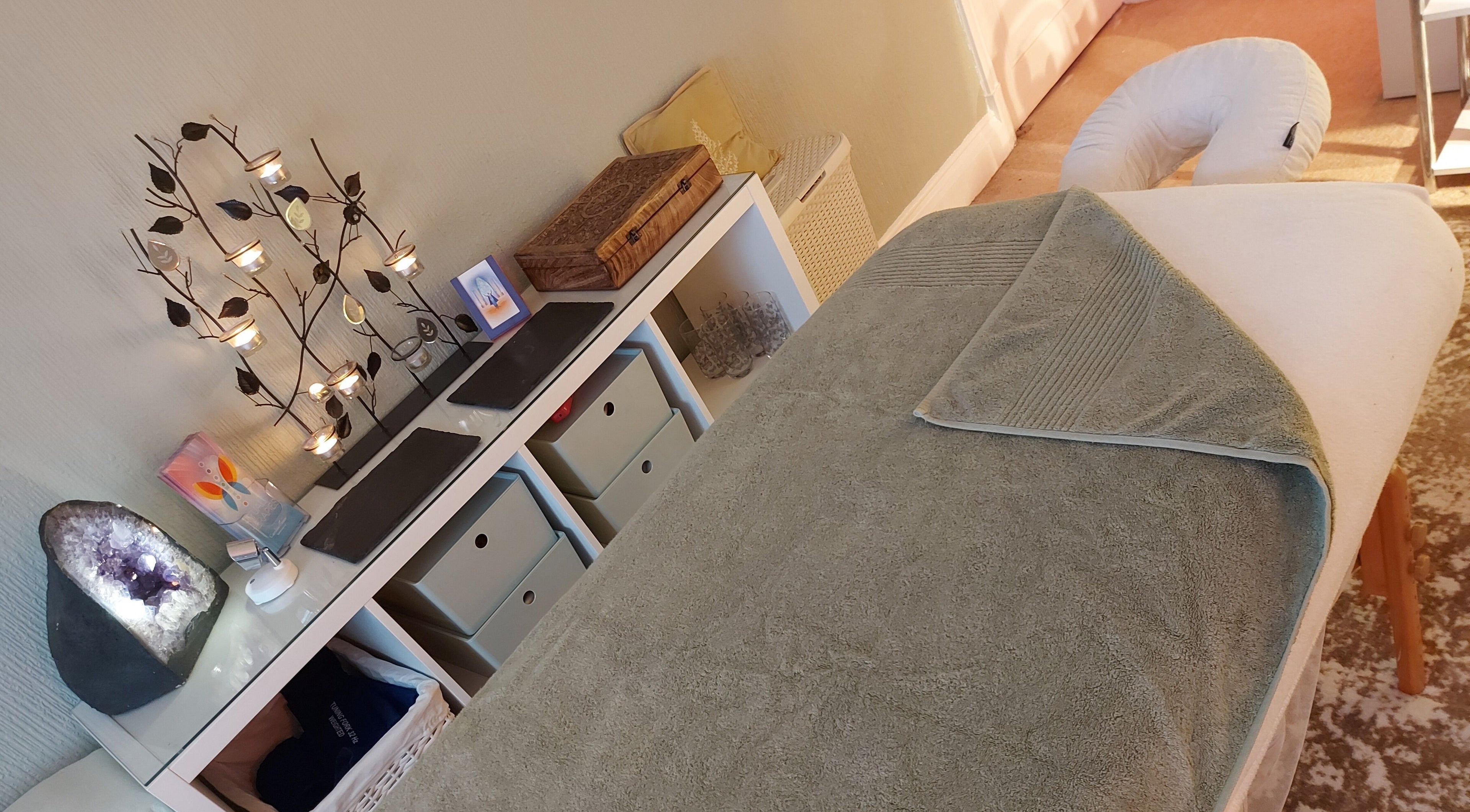 Tranquil therapy room at Caroline at Ritual Therapies, Birmingham, England, GB with cozy massage table.