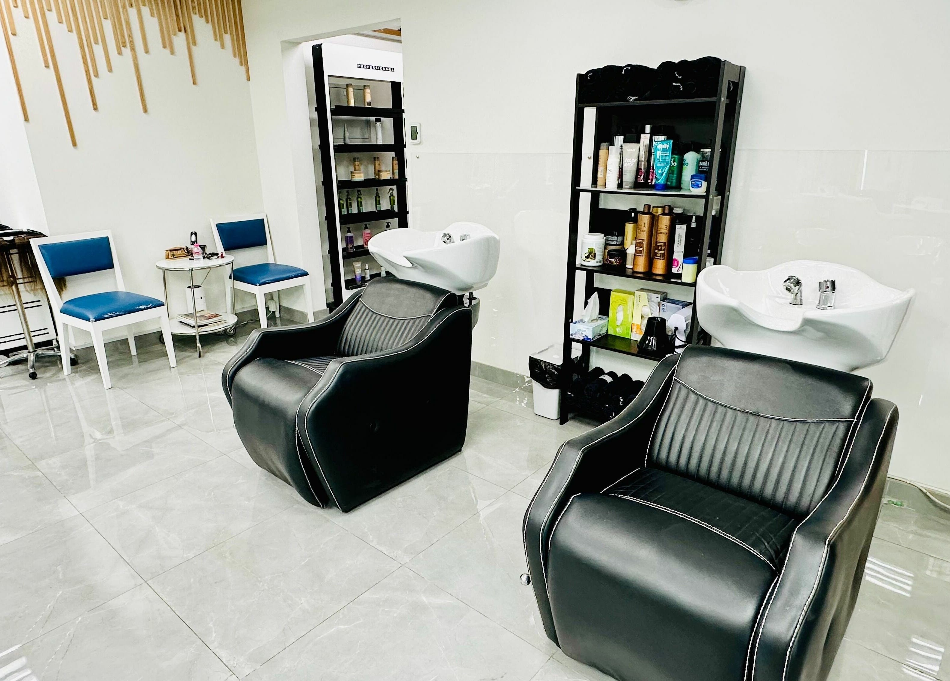 Interior of Ultimo Capelli Beauty Centre DMCC, Dubai. Relaxing salon chairs and hair wash stations.