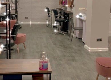 Elegant interior of House of Hair, Nottingham, England, GB, showcasing chic chairs and modern decor.