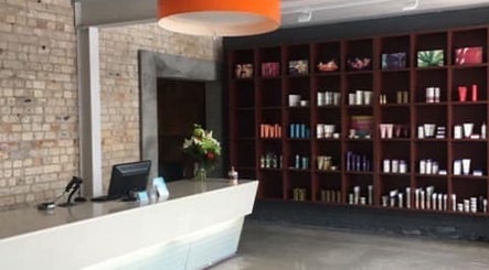 Elegant reception at Revival Hair Design, Huntly, Waikato, NZ with stylish product display.