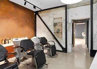 Modern salon chairs at Revival Hair Design, Huntly, Waikato, NZ showcasing stylish interior design.
