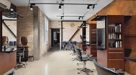Stylish salon interior at Revival Hair Design in Huntly, Waikato, NZ, featuring modern chairs and mirrors.