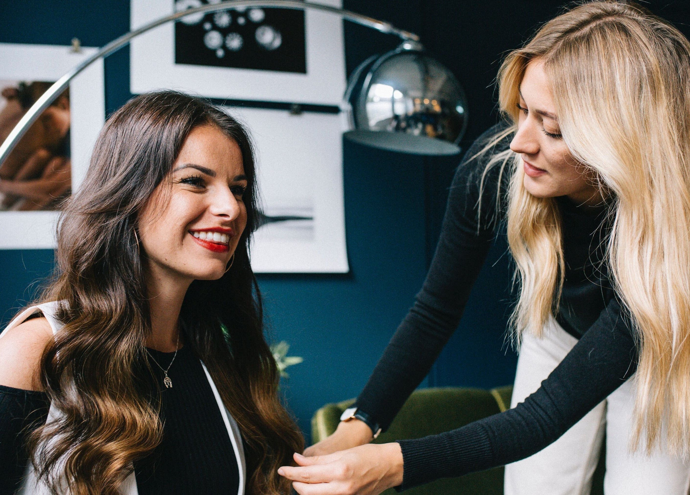 Professional hair styling at Home Studio E11, located in London, England, GB. Expert stylist with client.