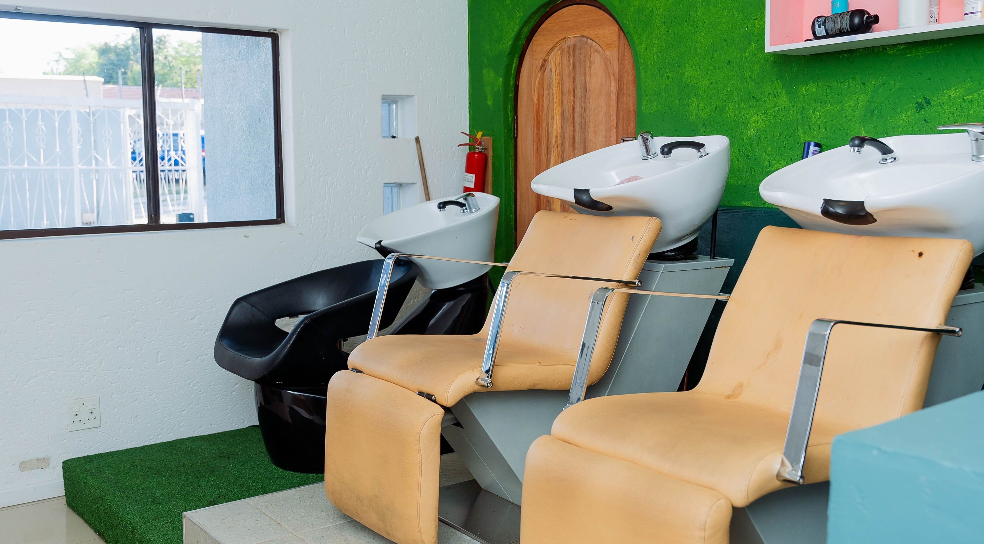 Modern hair wash stations at Lajawi Hair Salon in Sandton, Gauteng, ZA. Inviting and stylish salon interior.