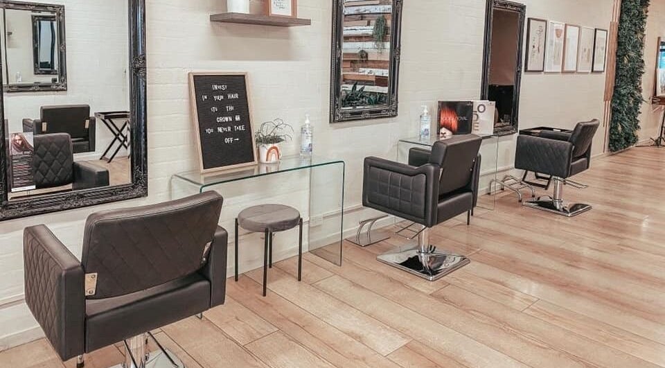 Elegant salon setup at Salon Seven, Warragul, Victoria, AU, showcasing stylish chairs and decor.