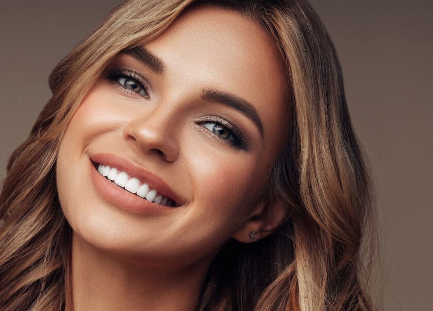 Elegant smiling woman showcasing beauty at Radiant Skin Aesthetics, Umhlanga, KwaZulu-Natal, ZA.