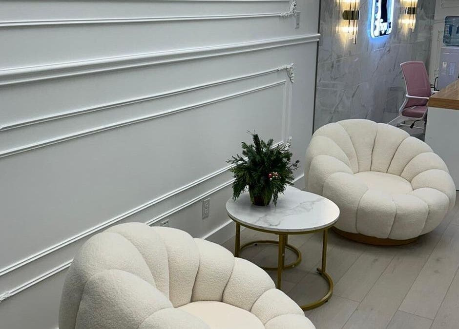Elegant waiting area at BellaDonna Aesthetics & Wellness DT Calgary, Calgary, Alberta, CA with plush seating.