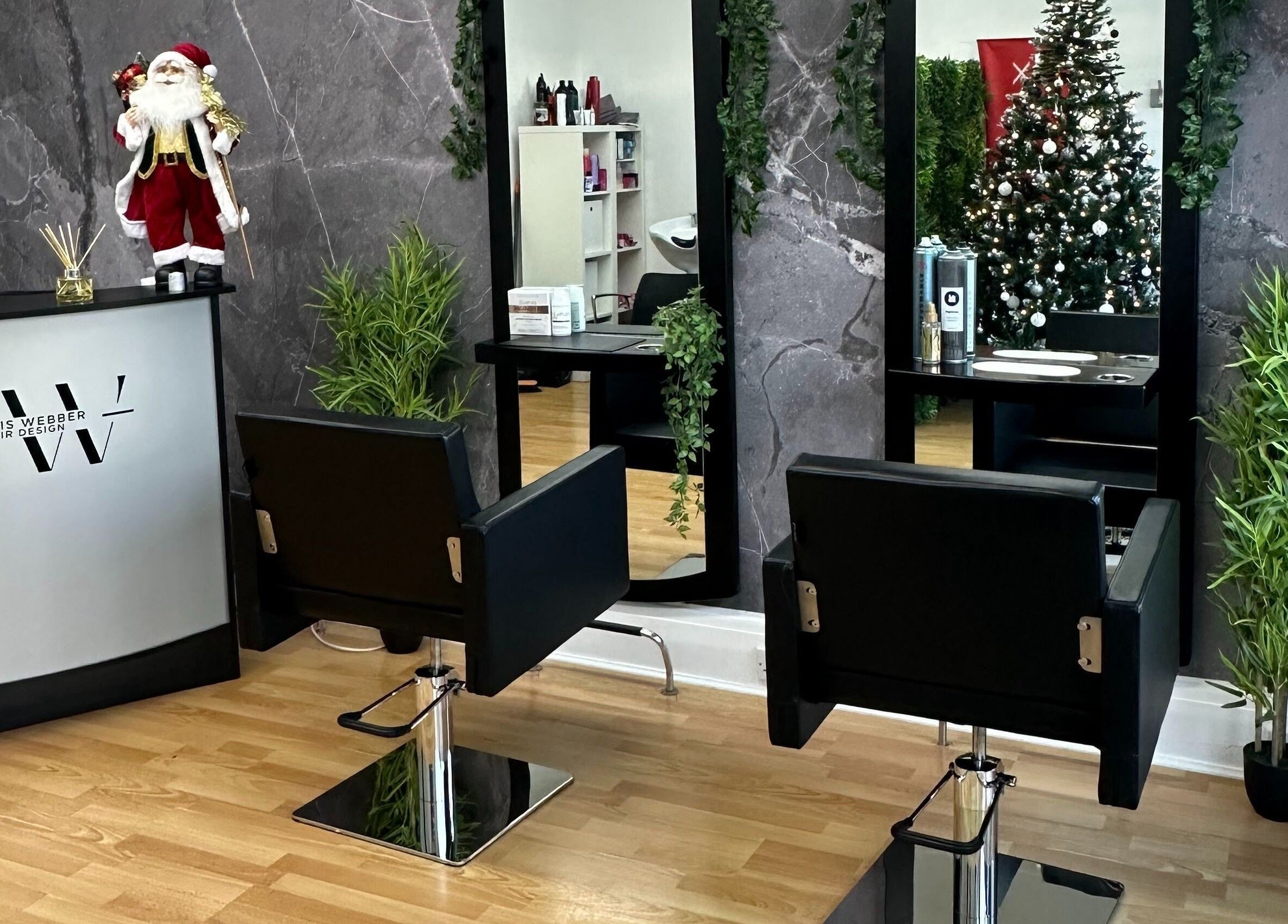 Festive decor at Travis Webber Hair Design, Lytham St Annes, England, GB with stylish chairs and mirrors.