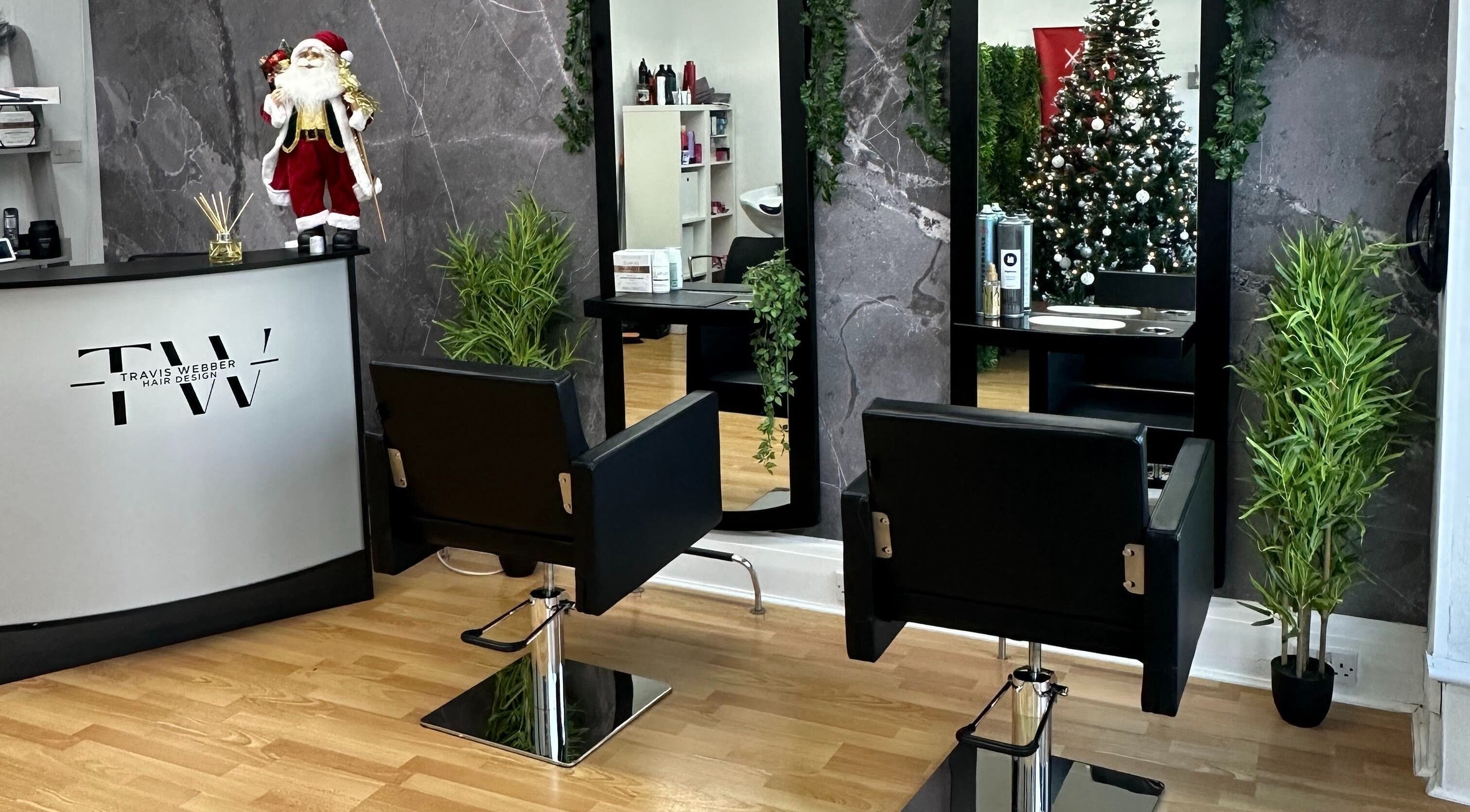 Festive decor at Travis Webber Hair Design, Lytham St Annes, England, GB with stylish chairs and mirrors.