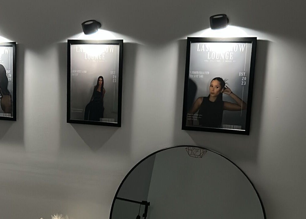 Elegant framed posters at Lash N Brow Lounge, Melbourne, Victoria, AU enhance the chic venue style.
