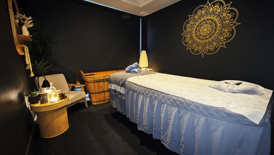 Relaxing massage room at Mandala Holistic Wellness and Aesthetics, Melbourne, Victoria, AU with ambient lighting.