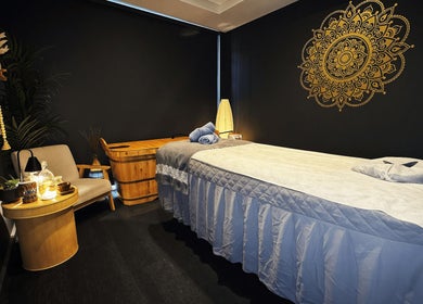 Relaxing massage room at Mandala Holistic Wellness and Aesthetics, Melbourne, Victoria, AU with ambient lighting.