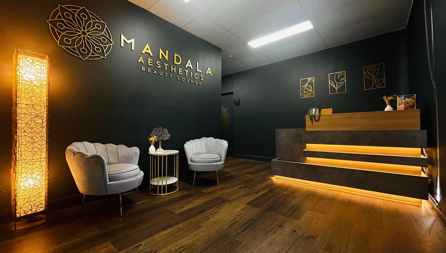 Stylish reception at Mandala Aesthetics in Melbourne, Victoria, AU with plush seating and warm lighting.
