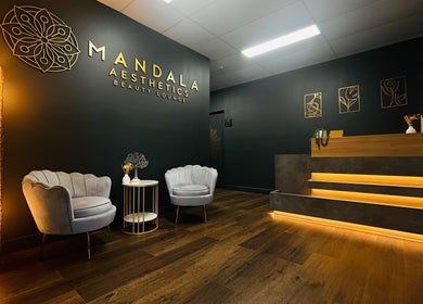 Elegant lobby of Mandala Aesthetics in Melbourne, Victoria, AU with warm lighting and modern decor.