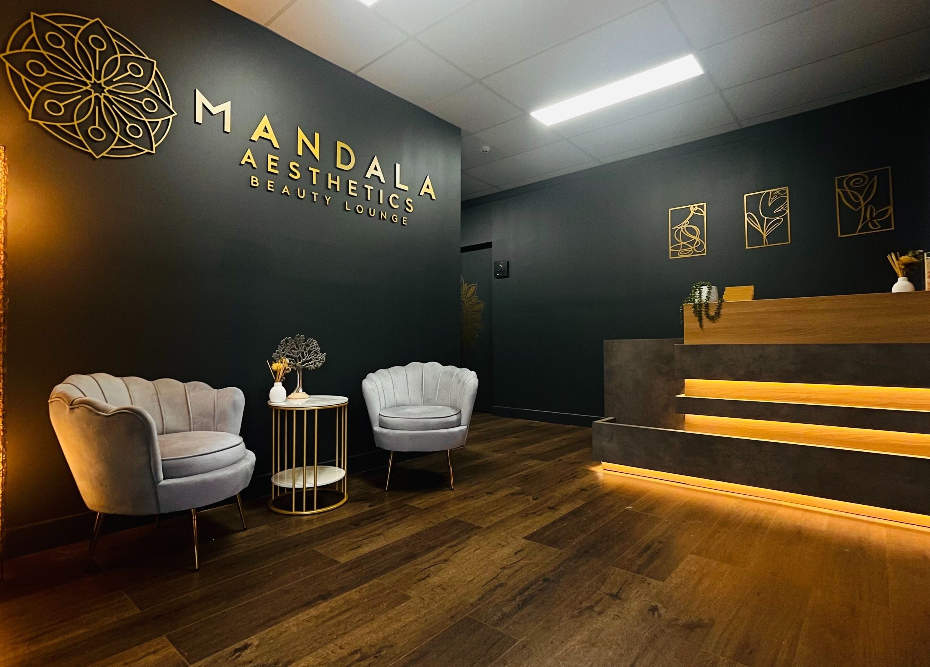 Stylish reception area at Mandala Aesthetics, Melbourne, Victoria, AU featuring cozy seating and modern decor.