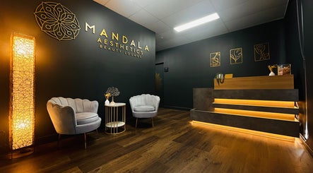 Stylish reception area at Mandala Aesthetics, Melbourne, Victoria, AU featuring cozy seating and modern decor.