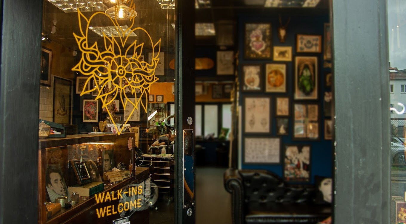 Entrance of Rivergate Tattoo in Luton, England, GB showcasing a welcoming artistic decor.