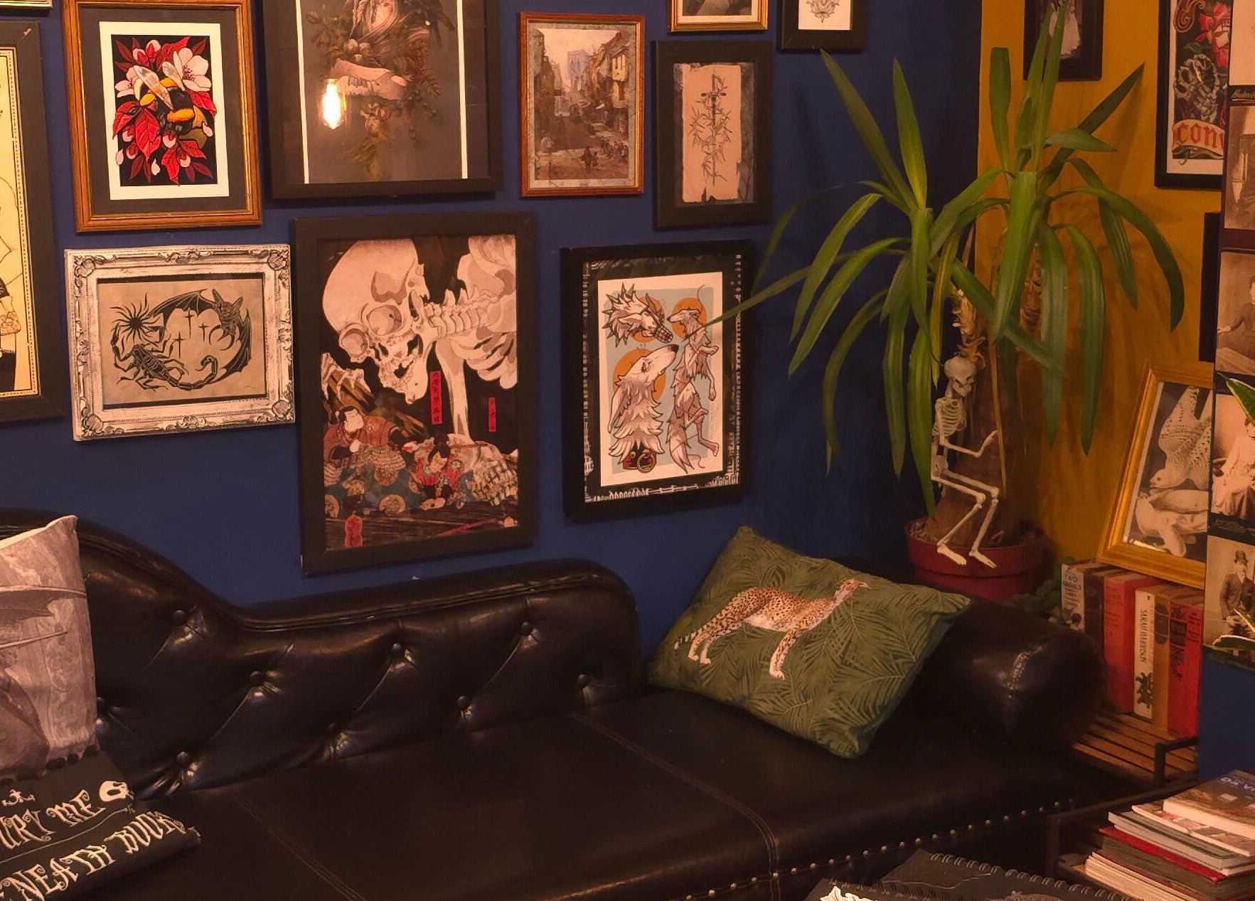 Stylish tattoo lounge at Rivergate Tattoo, Luton, England, GB with eclectic art and cozy seating.