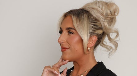 Woman with styled hair and natural makeup at Filled with Love Aesthetics, Coventry, England, GB.