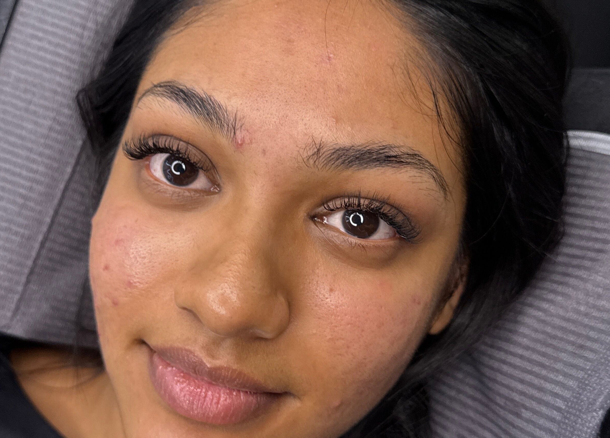 Close-up of a woman's face showcasing eyelash extensions at Allure Beauty by Ash, Toongabbie, New South Wales, AU.