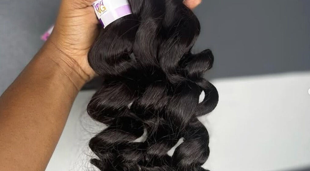 Premium black hair extensions available at Loc’d In Hair Studio, St. Catherine, JM for perfect styling.