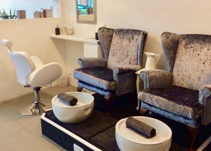 Luxurious pedicure seating at Skin Squared, Whiteley, England, GB. Elegant chairs beside modern pedicure bowls.