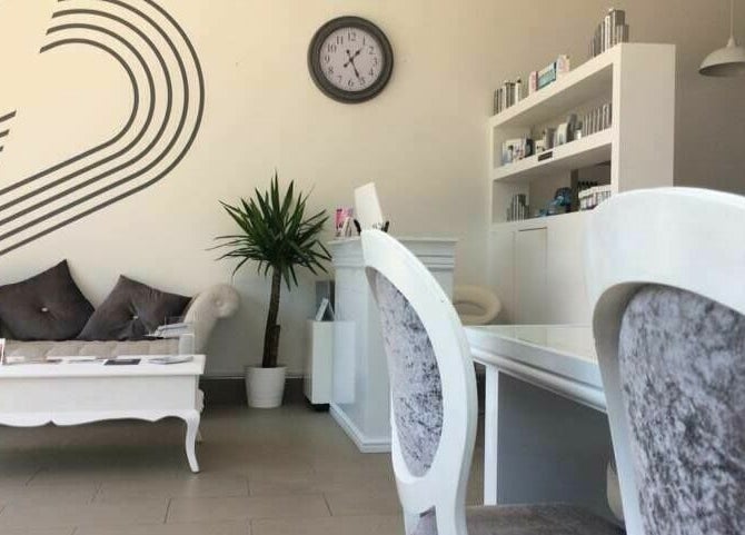 Chic waiting area with modern decor at Skin Squared, Whiteley, England, GB. Elegant seating and minimalist design.