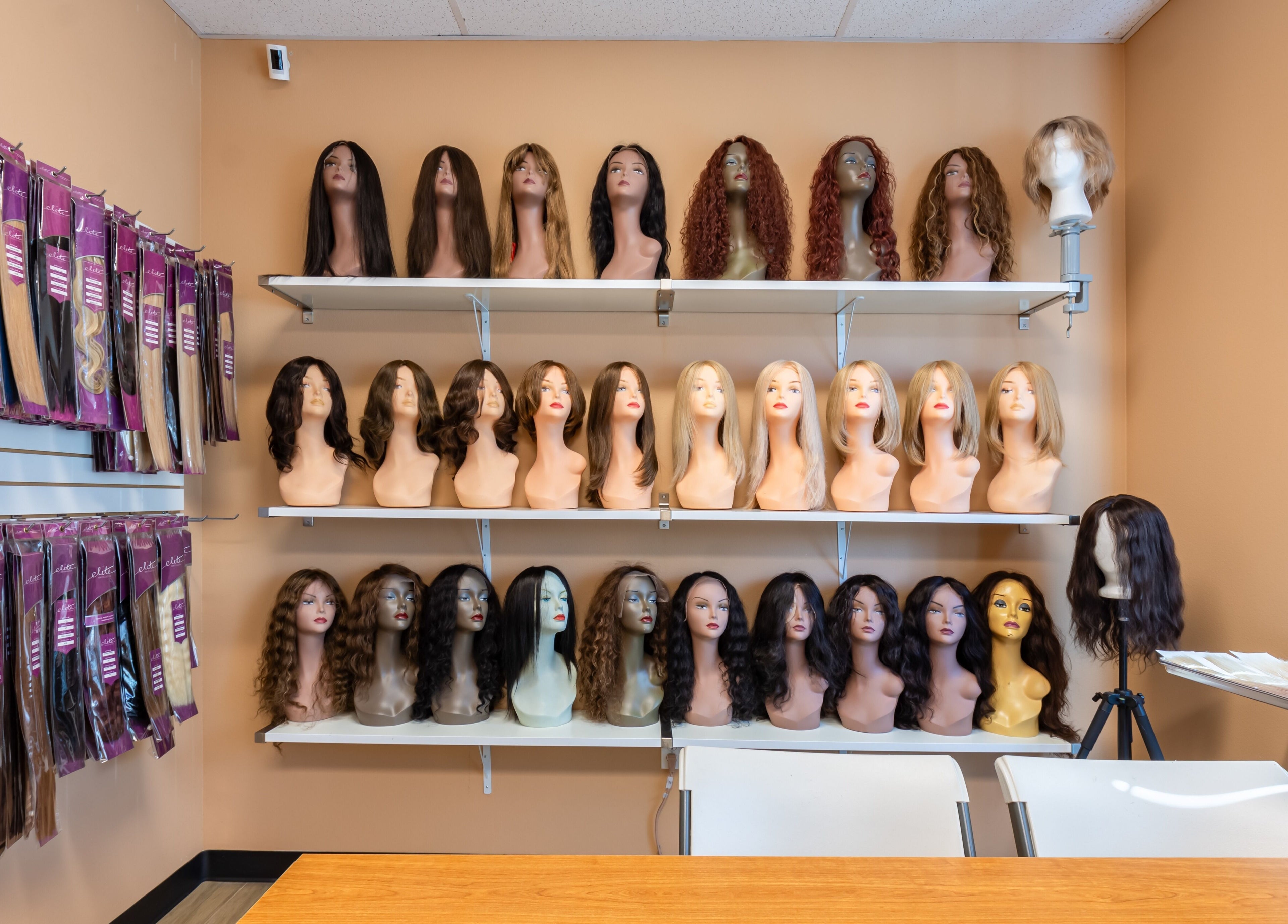 Assorted wigs and hairpieces on display at Best Hair System in Rancho Cucamonga, California, US.
