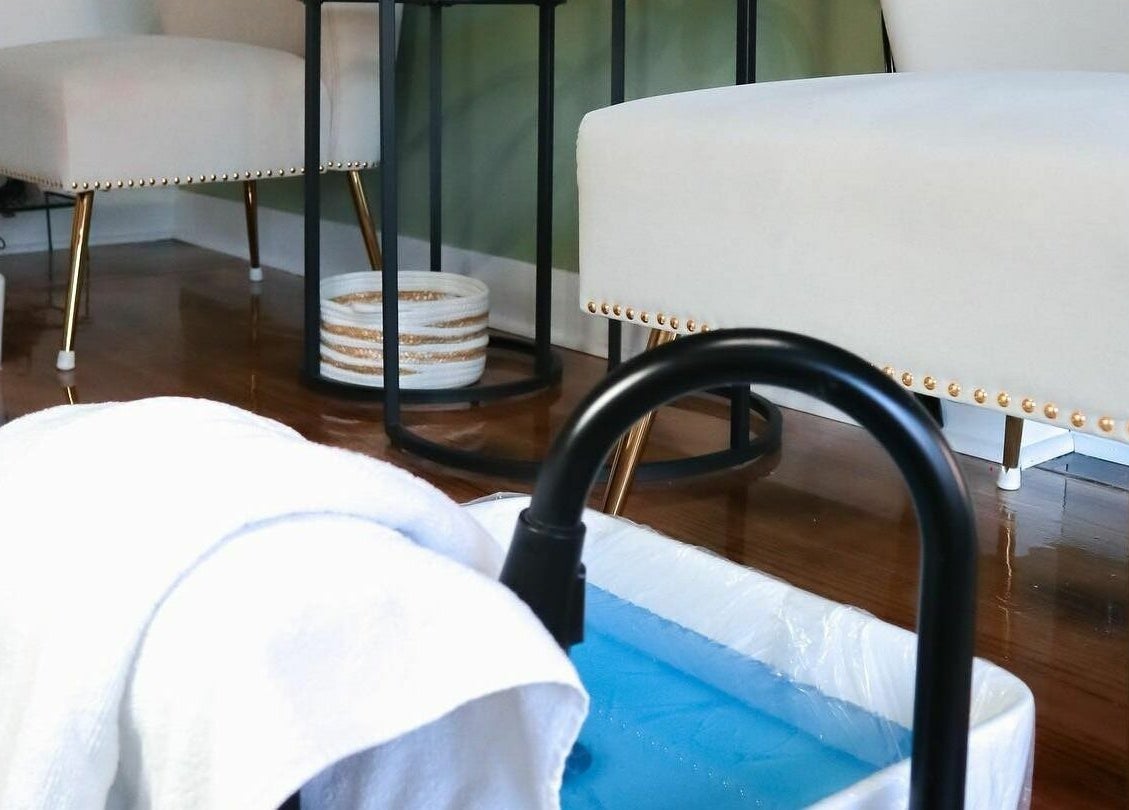 Luxurious pedicure setup at Studio Kay Belle in Montréal, Québec, CA with elegant seating and foot spa.