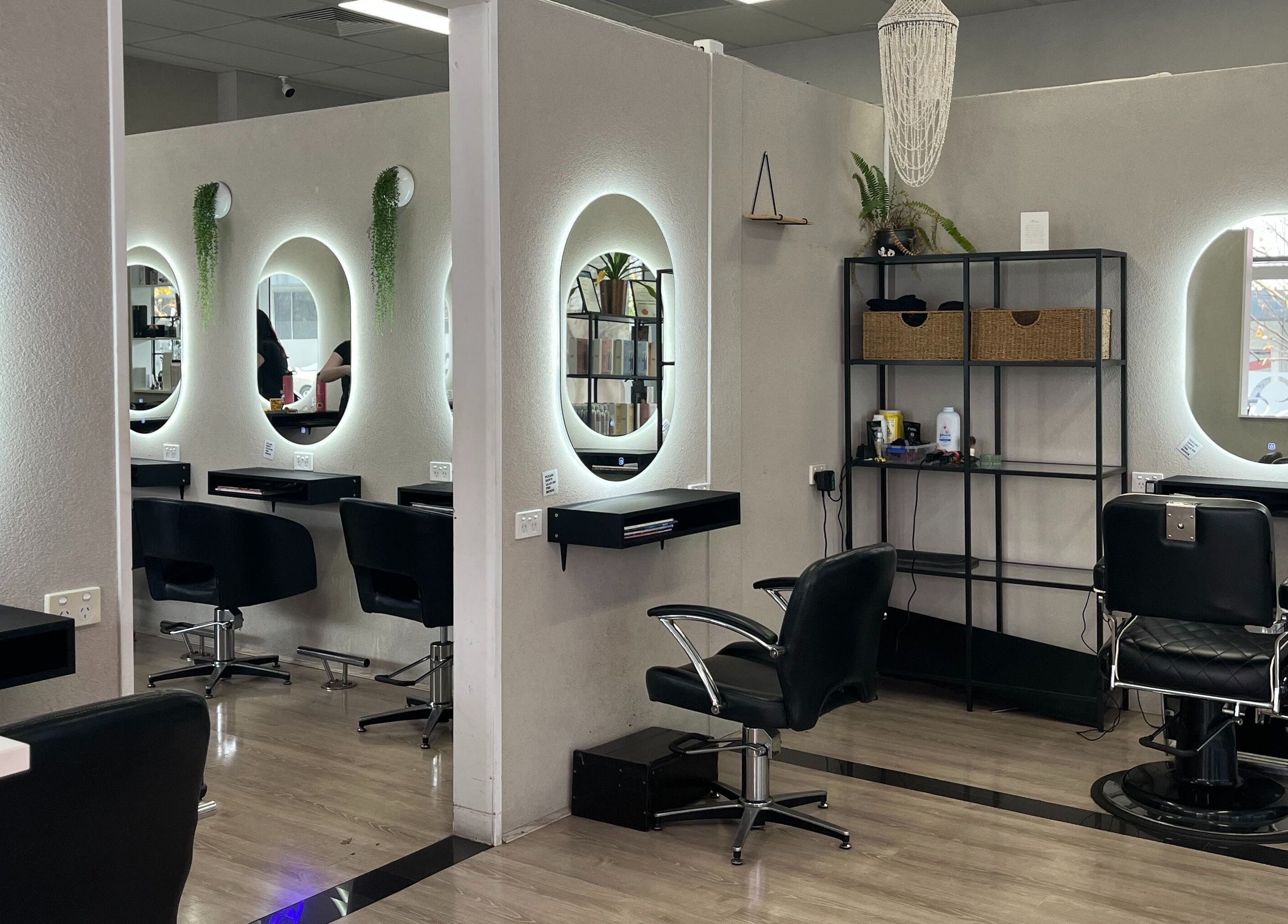 Modern interior of Bella J's Unisex Hair Studio, Alkimos, Western Australia, AU with illuminated mirrors.