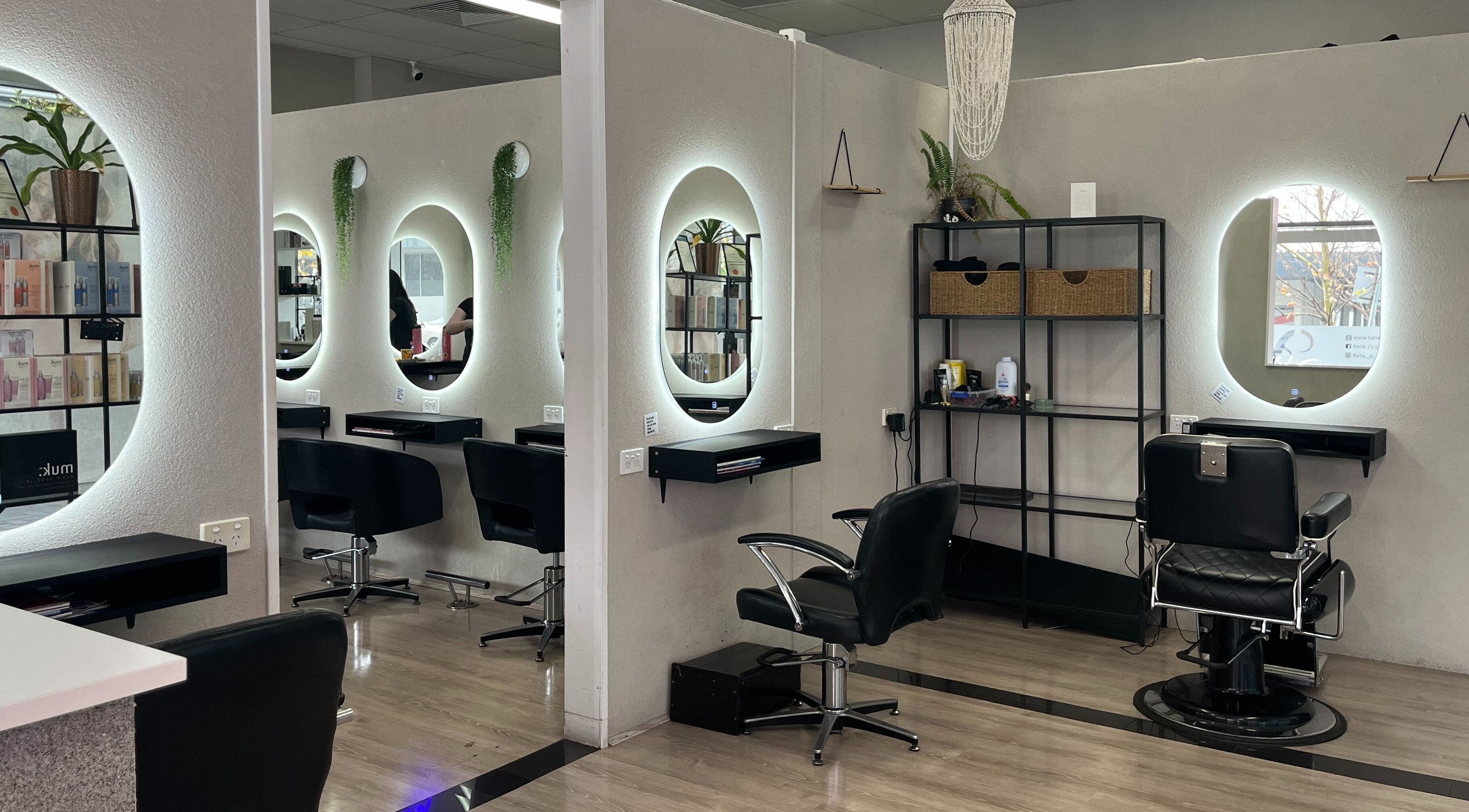 Modern interior of Bella J's Unisex Hair Studio, Alkimos, Western Australia, AU with illuminated mirrors.