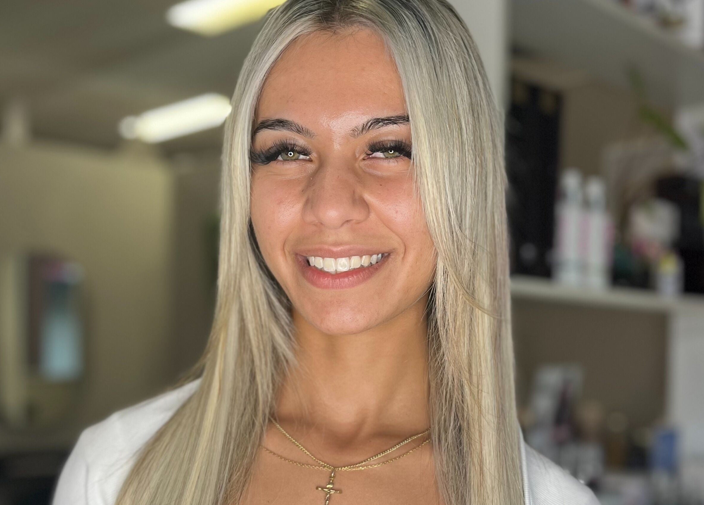 Happy client at Bella J's Unisex Hair Studio, Alkimos, Western Australia, with expertly styled hair.