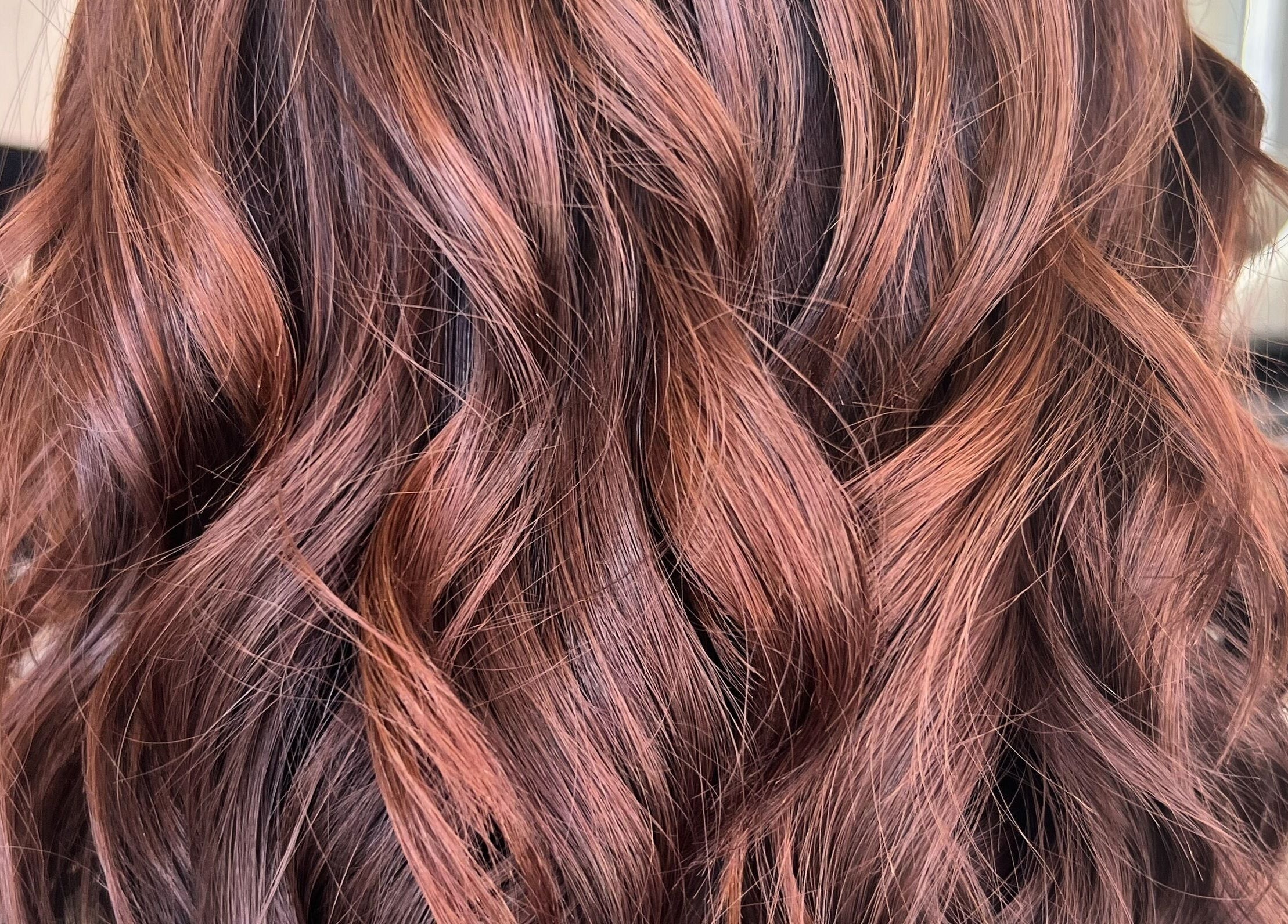 Vibrant copper curls styled at Bella J's Unisex Hair Studio, Alkimos, Western Australia, AU.