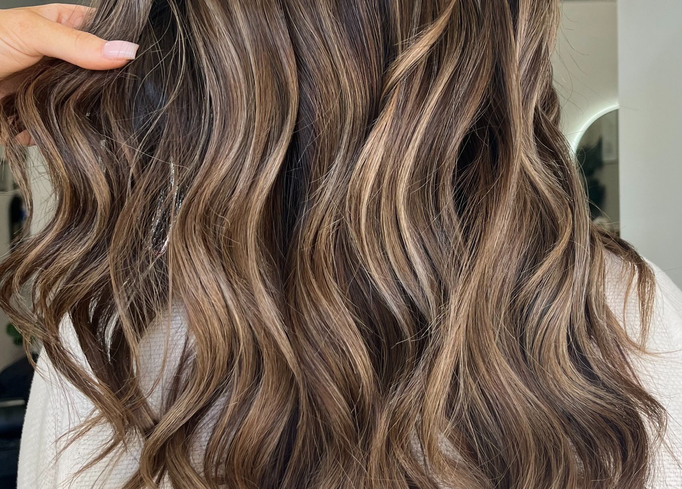 Luxurious wavy hairstyle at Bella J's Unisex Hair Studio, Alkimos, Western Australia, AU.