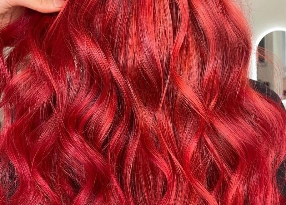 Lustrous red waves styled at Bella J's Unisex Hair Studio, Alkimos, Western Australia, AU.