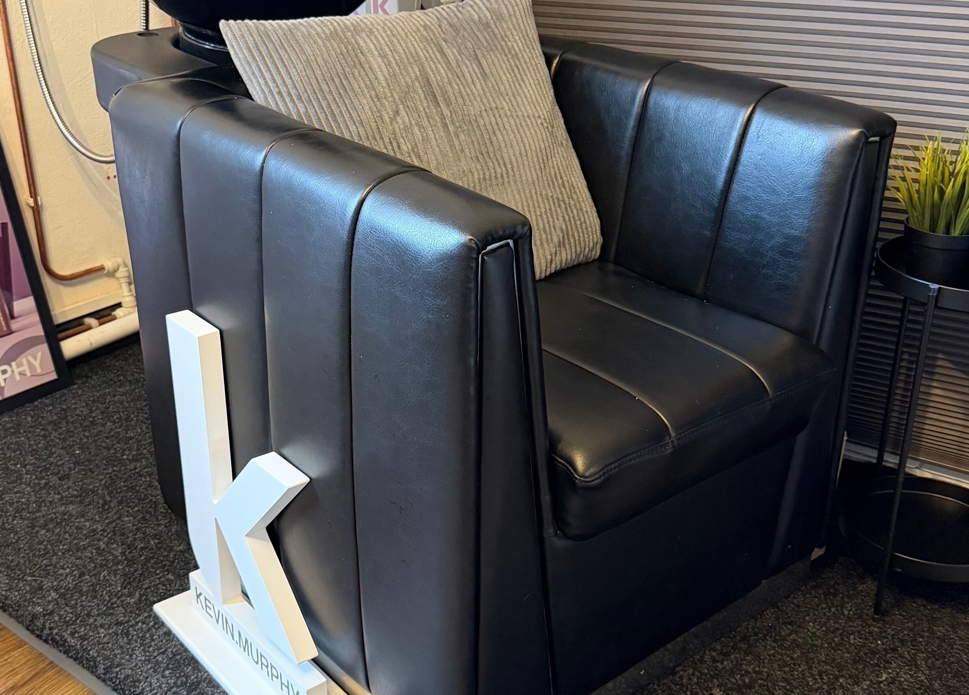 Stylish seating area at The Colour Room, Alcester, England, GB, showcasing modern comfort and elegance.