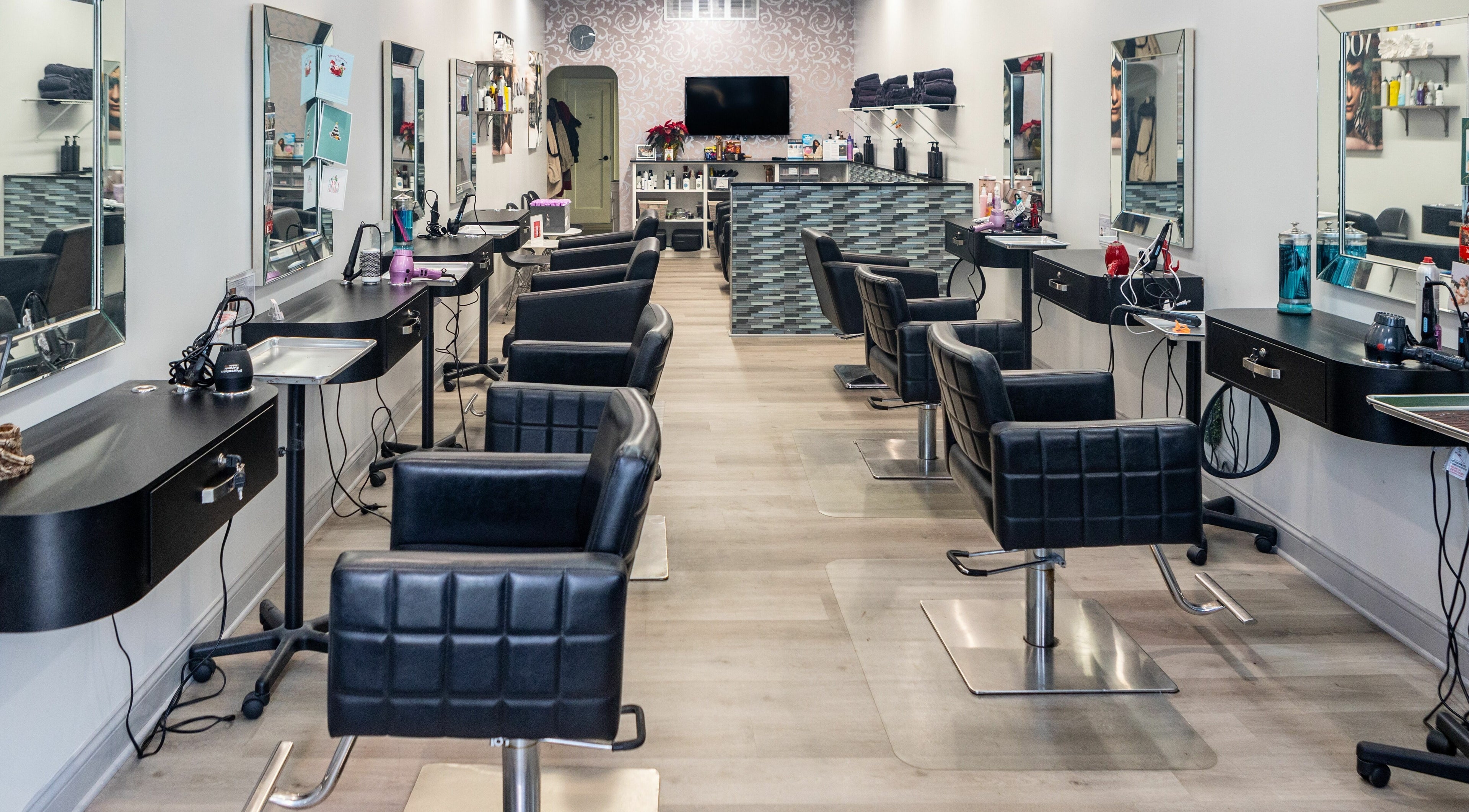 Modern salon interior at Blown Inc, New York, New York, US showcasing stylish black chairs and sleek design.