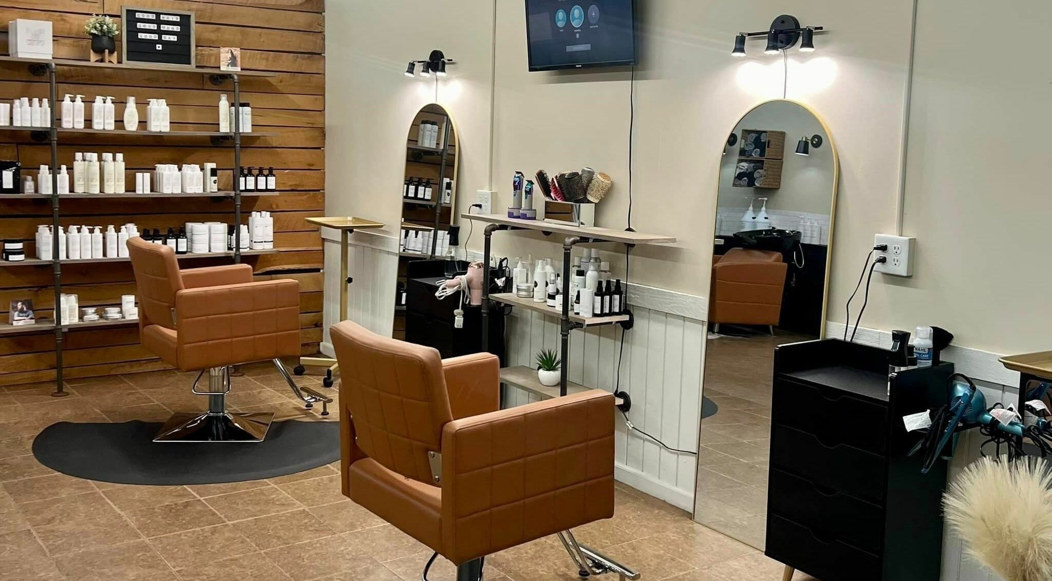 Modern salon interior at Shear Sisterz Salon and Boutique LLC, Palmyra, Missouri, showcasing styling stations.