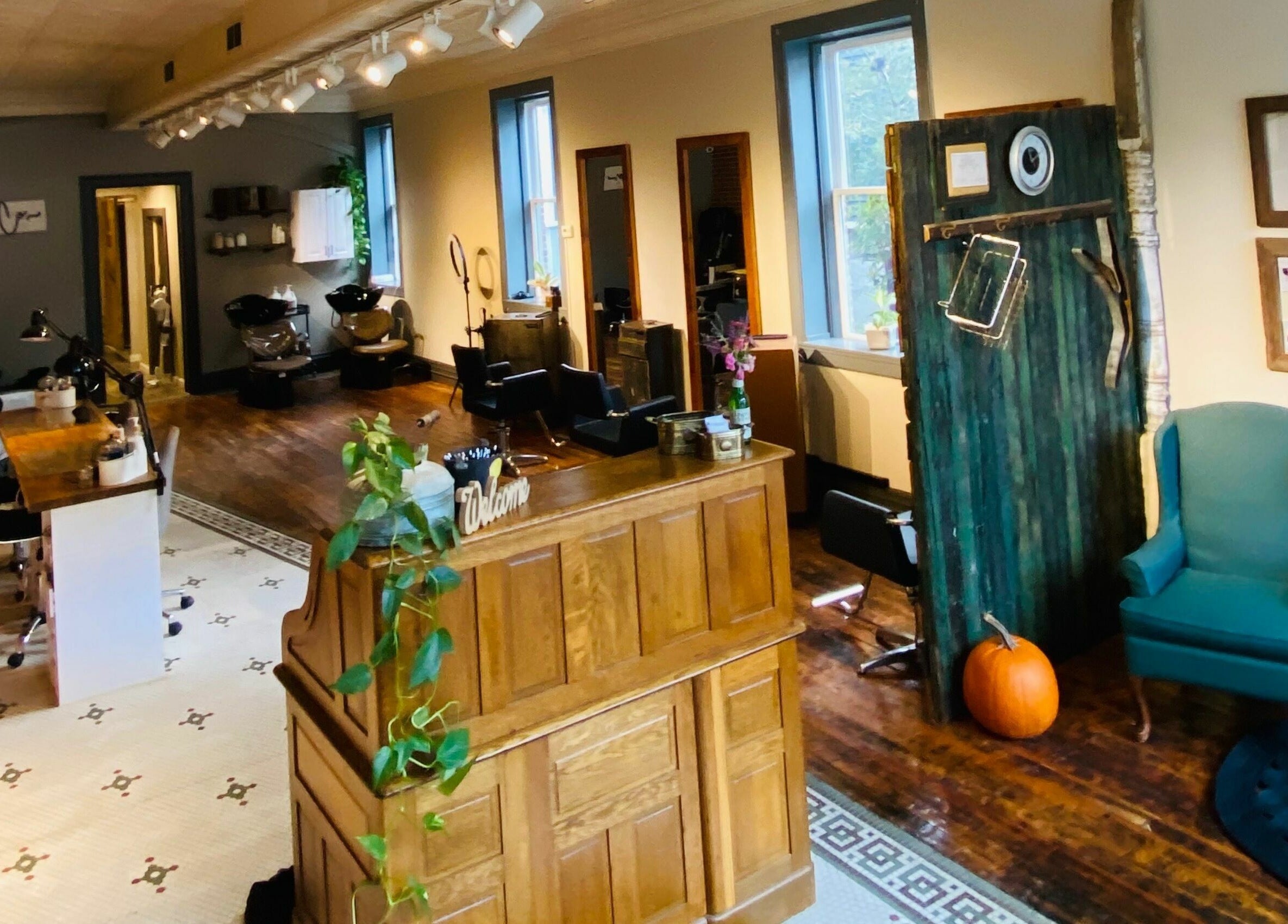 Tobias & Co. Salon interior with wooden decor and seating in Hammondsport, New York, US.