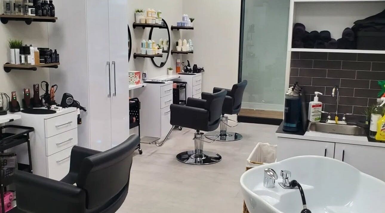 Modern interior of Meadowvale Hair Salon Inc. in Mississauga, Ontario, CA showcasing styling chairs and products.